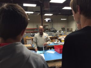 James Wallace, Electro Soft founder, is putting on a manufacturing day demonstration for students in this picture. MFG Day 2017 Manufacturing Day 2017 tours