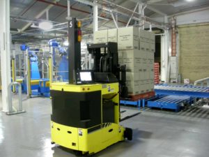 A picture of an automated guided vehicle moving a pallet full of boxes. Autonomous vehicles will soon be taking their place. 